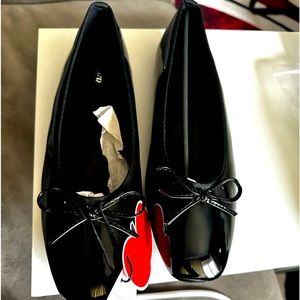 Shiny black ballet flats (new with tags) women size between 9-10.